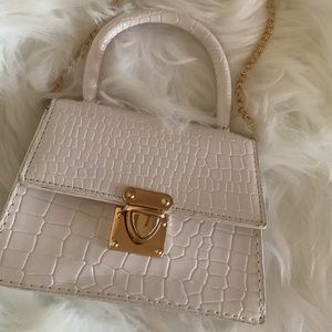 Small white purse with gold chain